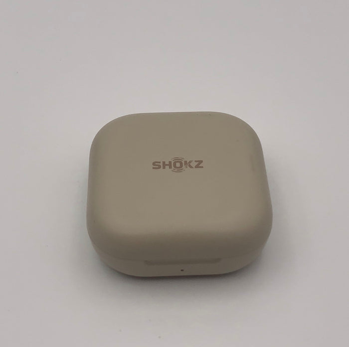 Coloris beige : boîtier de charge, couvercle